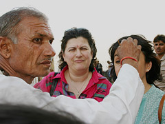 Dr Préziosi receiving a sign of blessing